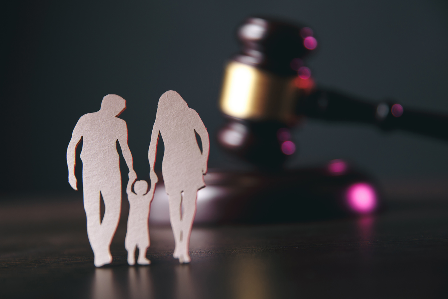 Family figure and gavel on table. Family law